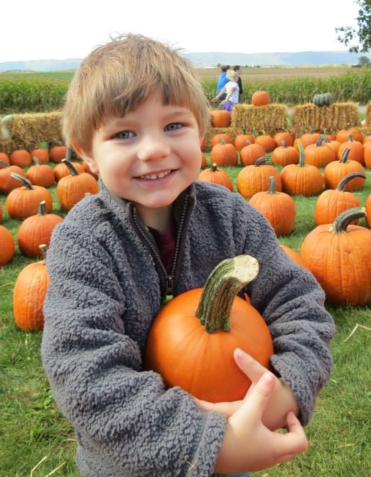 Smiling with a pumpkin!